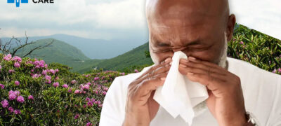 Man sneezing over a background of Craggy Gardens